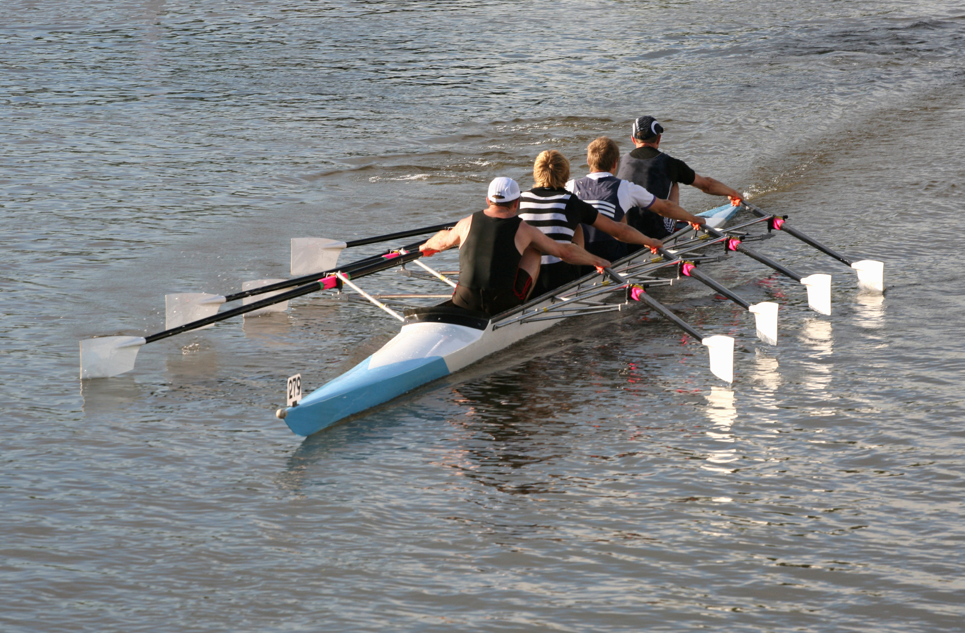 A group of people rowing in a boat